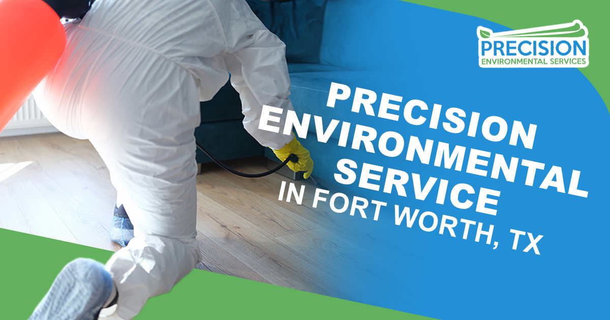 Image of a worker in a protective suit applying disinfectant solution on the floor under a sofa in an apartment, featuring Precision Environmental Services and highlighting their services in Fort Worth, TX.