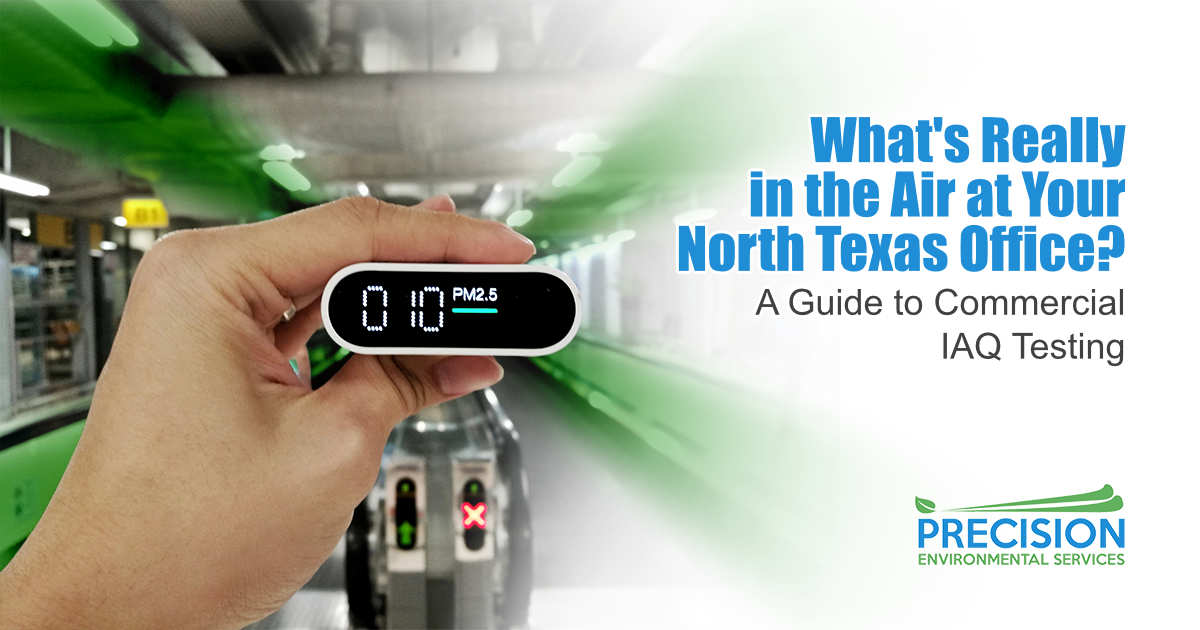 Hand Holding PM2.5 Air Quality Monitor at Airport Transit Area A hand holds a small oval portable air quality monitor displaying a PM2.5 reading of 10 µg/m³ inside a busy airport transit corridor with moving walkways in the background.
