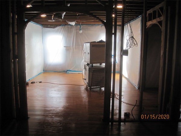 Photo of interior room of a home in an asbesotos removal project overseen by Precision Environmental Services.