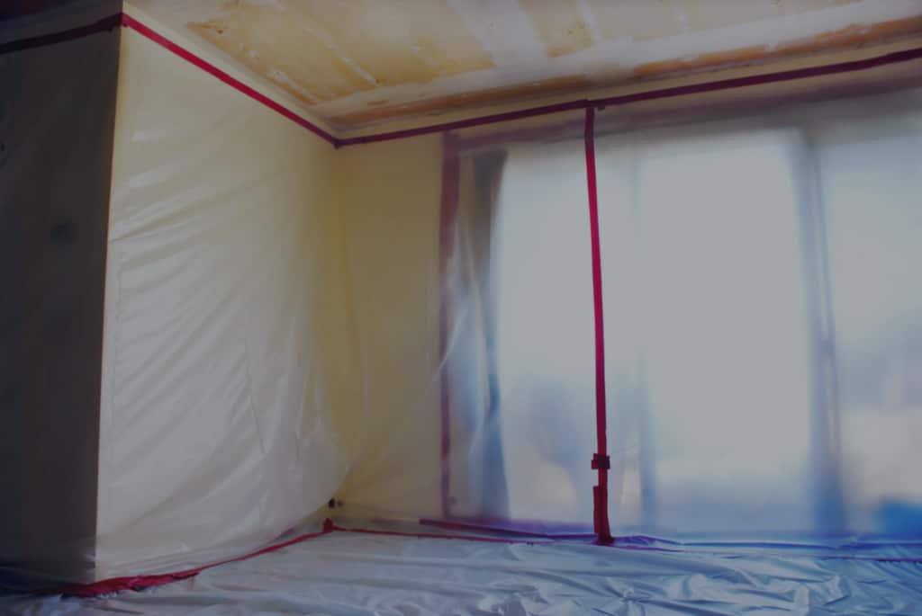 Room taped off in a mold remediation project overseen by Precision Environmental Services.